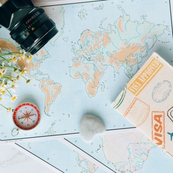 A world map with travel supplies